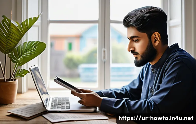 학습 도구 활용법 - A modern Pakistani student in a cozy home study environment using a laptop and smartphone simultaneo...